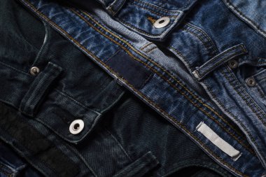 Pantolon deseni ya da kot pantolon arkaplanı. Denim satışları. Kotun kumaş dokusu. Pantolon pantolonu. Mavi kot kumaş. Arkaplan tasarımı için Denim dokusu. Kot kumaşı