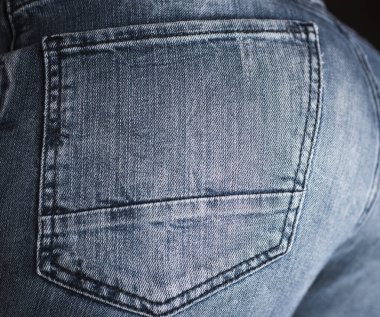 Denim kot kumaşı. Kot pantolonun yakın dokusu. Jean arka planı. Denim dokusu. Arkaplan için Denim dokusu. Kotlar desenli arka plan için