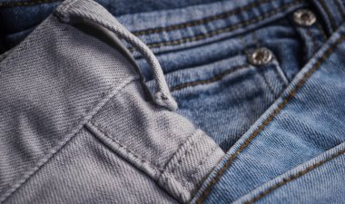 Kot pantolon kumaşına yakın çekim. Kot pantolon arka planı. Denim dokusu. Arkaplan için Denim dokusu. Denim kot kumaşı. Kotlar desenli arka plan için