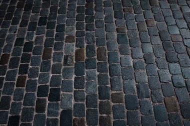 Çakıl taşının arka planı. Taş kaplama yolu olan bir mimari geçmişi var. Beton döşeme arka planı. Poster veya afiş için taş yol arkaplanı