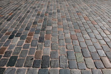 Çakıl taşının arka planı. Taş kaplama yolu olan bir mimari geçmişi var. Beton döşeme arka planı. Poster veya afiş için taş yol arkaplanı