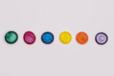 LGBT. LGBTQ. Condom contraception. Sex protection. Latex condom. Protection from pregnancy. Birth control condom. Sexually transmitted diseases or HIV. Safe sex concept. Prevent infection clipart