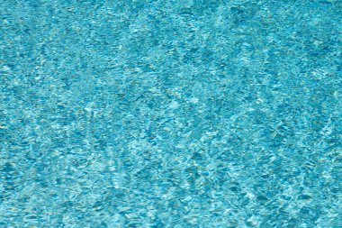 Havuz dalgalarının arka planı. Su dalgası. Havuz suyu yüzeyinin arka planı. Arkaplan dokusu. Yüzme havuzunda su. Dalgalı su dokusu