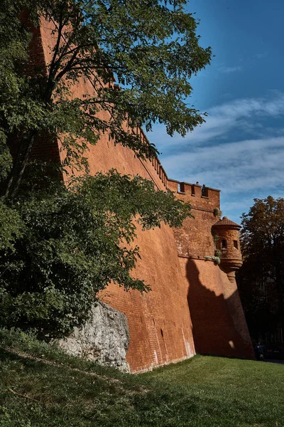 red brick castle wall in Krakow