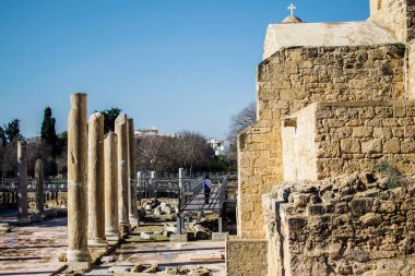 Paphos, Cyprus - December 30, 2018: open free exhibition ancient ruins in the city of Paphos clipart