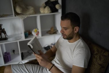 30-year-old man with a Bible attends an online church service, talks with the pastor                               clipart