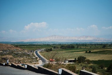 Artashat, Armenia - August 28, 2021: view of the city of Artashat and Ararat from the monastery Khor Virap clipart