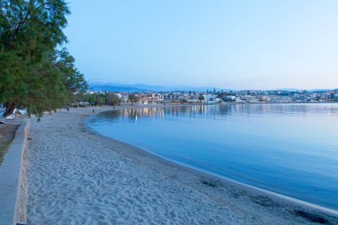 Landscape view of Sunset beach in the evening in clear spring weather, Agioi Apostoloi, Crete, Greece. clipart