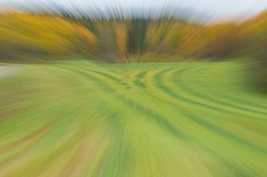 ICM Intentional camera movement with long exposure of colorful farm field. clipart