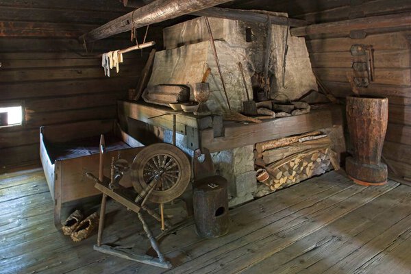 Interior view of room of a old wood building with vintage furniture.