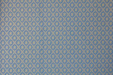 Eski kumaş dokusunun soyut süslemelerle yakınlaştırılması.