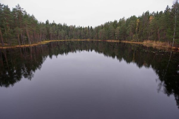 Aerial landscape view of lake Vaara-Musta in autumn, Espoo, Finland.