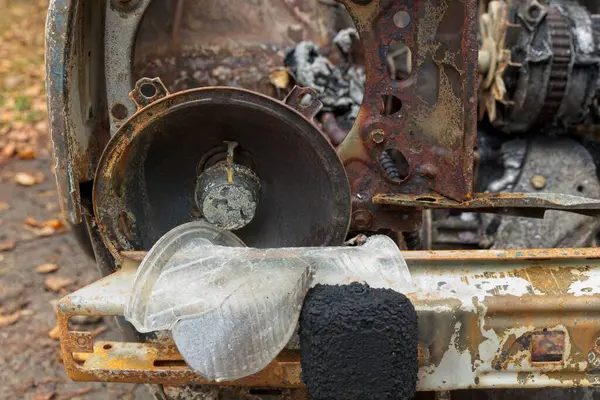 Closeup of a head lamp of a burned car.