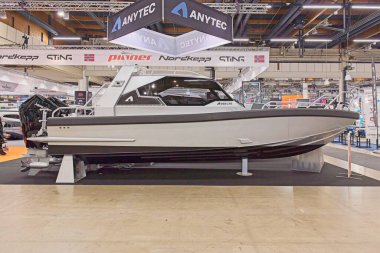 Pasila, Helsinki, Finland - 2.14.2024:  Anytec 868 CAB boat on display at Vene (Boat) 2024 fair at Messukeskus Helsinki (Expo and Convention Centre).