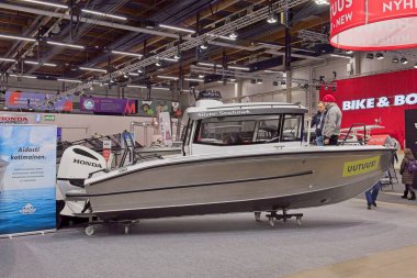 Pasila, Helsinki, Finland - 2.14.2024:  Siver Seahawk Cabin boat on display at Vene (Boat) 2024 fair at Messukeskus Helsinki (Expo and Convention Centre).