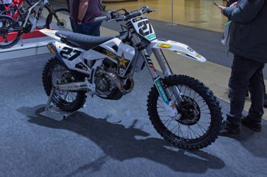 Pasila, Helsinki, Finland - 2.3.2024: Husqvarna Number 27 racing motorcycle on display at MP 24 Motorcycle fair at Messukeskus Helsinki (Expo and Convention Centre).