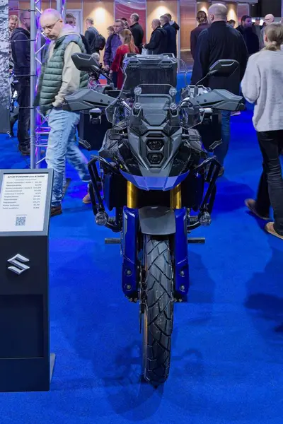 stock image Pasila, Helsinki, Finland - 2.3.2024: Suzuki V-Strom 800 DE motorcycle on display at MP 24 Motorcycle fair at Messukeskus Helsinki (Expo and Convention Centre).