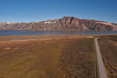 Aerial view of Austertanaveien road 890 in clear summer weather, Varanger Peninsula, Norway. clipart