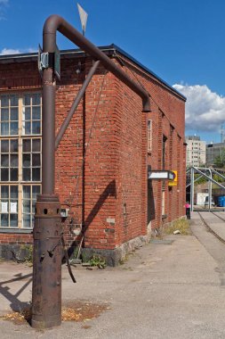 Old water filling station for steam locomotives in summer, Pasila, Helsinki, Finland. clipart