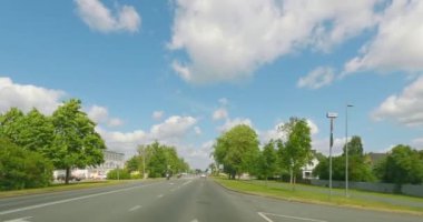 Kuressaare, Saaremaa, Estonia - July 1.2023 : POV view from car driving in Kuressaare city on a asphalt road in summer.