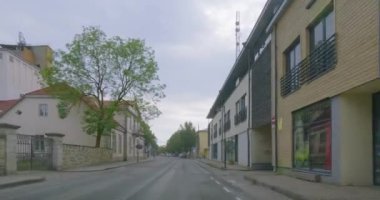 Kuressaare, Saaremaa, Estonia - July 1.2023 : POV view from car driving in Kuressaare city center on a asphalt road in summer.