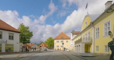 Kuressaare, Saaremaa, Estonia-July 4.2023 : POV view from car driving in Kuressaare city center on a asphalt road in cloudy summer weather.