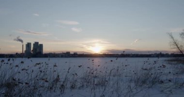 Sunset view of Verkkosaari over frozen sea in winter, Helsinki, Finland.