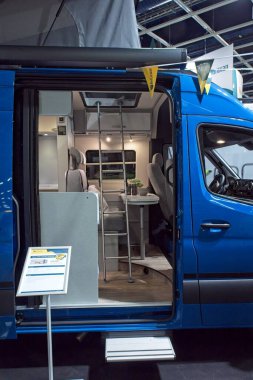 Pasila, Helsinki, Finland  January 17. 2025 : Hymer Free 600 Blue Evolution interior on display at Caravan 25 fair at Messukeskus Helsinki (Expo and Convention Centre). clipart