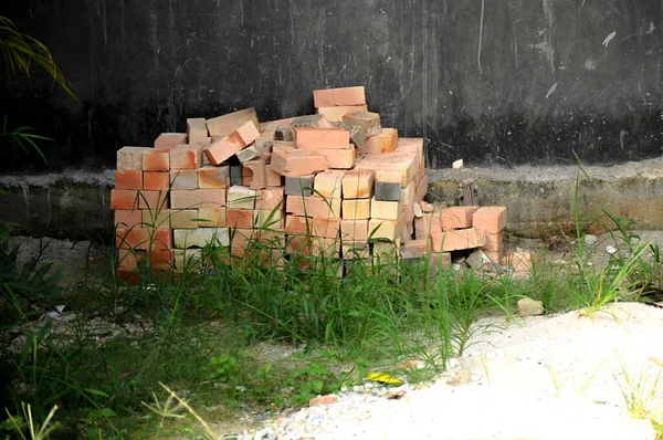 Pile of bricks in the yard of a building under construction