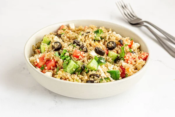 Healthy Quinoa Salad in a Bowl Top Down Close Up Photo on White Background