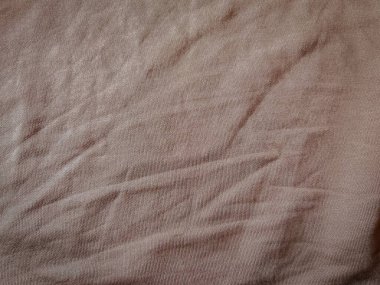 Yumuşak, buruşuk yüzeyi, tasarım, tekstil ya da minimalist dekor temaları için ideallerini gözler önüne seren dokulu bir kumaş..