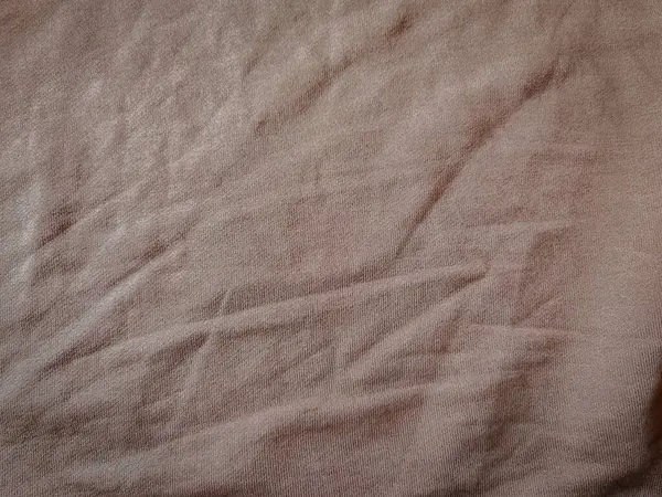 Yumuşak, buruşuk yüzeyi, tasarım, tekstil ya da minimalist dekor temaları için ideallerini gözler önüne seren dokulu bir kumaş..