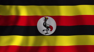 Ugandalı ulusal bayrak sallıyor, canlı sarı, siyah ve kırmızı renkler gösteriyor yumuşak, dinamik arka plana karşı ulusal gurur ve birliği simgeliyor.