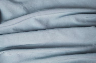 Arkaplan ve tasarım için grimsi mavi kumaş dokusu, güzel buruşuk ipek ya da keten deseni.