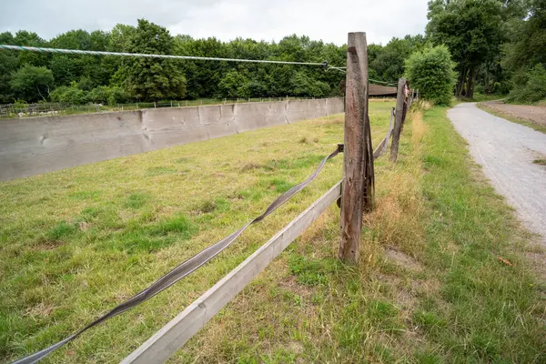 a fence and a wire fence in the countryside