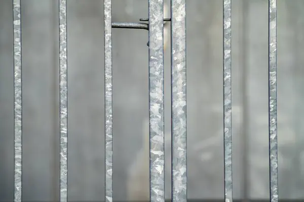 cut-out of a galvanized metal gate