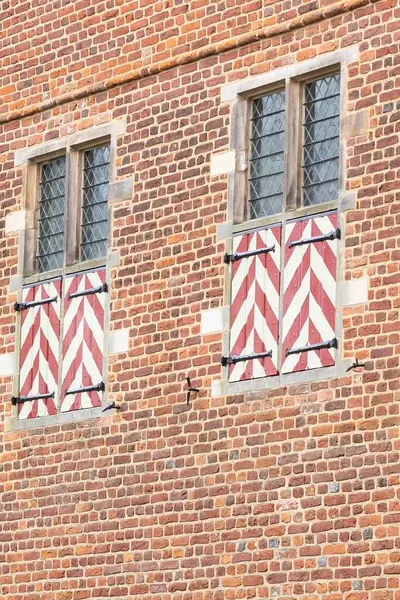 red brick wall with window