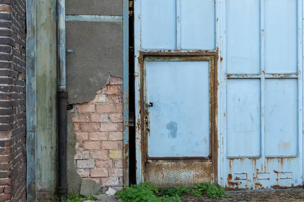 stock image unkempt old commercial building in the sun