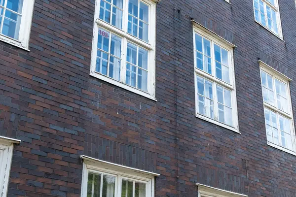 stock image brick house wall with even windows