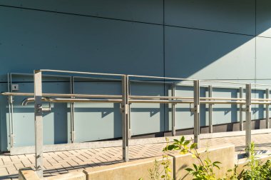 ramp for wheelchair users at office building clipart