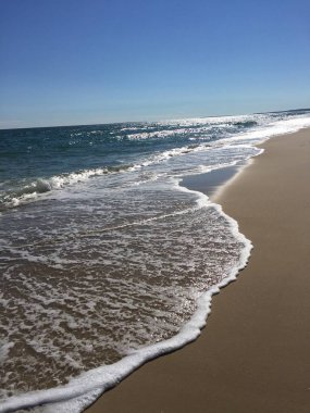 Beach walk along the east coast shoreline as the tide rolls in