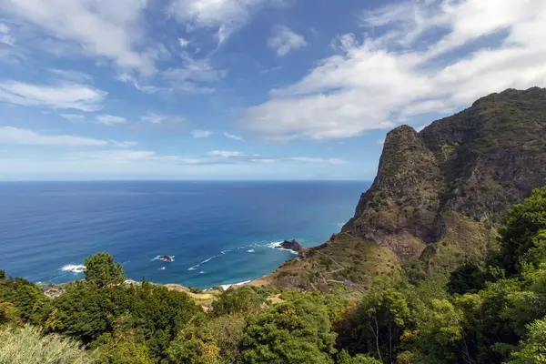 stock image the rugged cliffs, lush flora, and vast Atlantic Ocean near Boaventura on the northern coast of Madeira, Portugal, showcasing the islands natural beauty and dramatic landscape