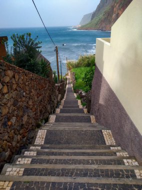 long stone stairs to the Atlantic Ocean in Jadrim do Mar on the island of Maderia (Portual) clipart