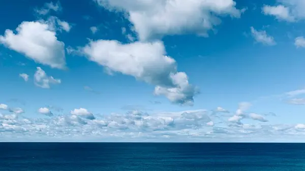 Blue ocean, clouds and sunshine, North Stradbroke Island, Queensland, Australia