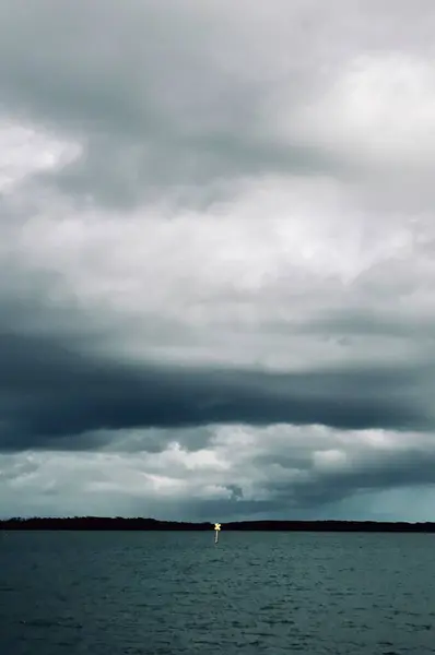 a vertical shot of a cloudy sky above the ocean, Sunshine Coast, Queensland, Australia