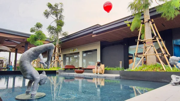 stock image Jakarta Nov 01 2023: Beautiful azure pool with steel sculpture artworks and nice tropical landscaping.