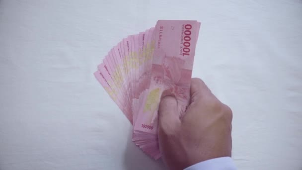 Stack Money Idr 100 000 Neatly Arranged White Table — Stock Video