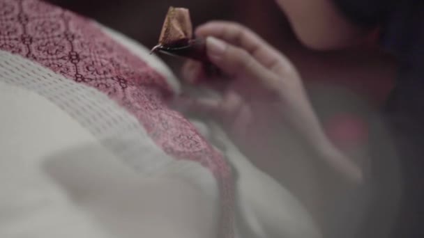 Female Hand Holding Canting Making Batik Tulis Written Batik Red — Stock Video