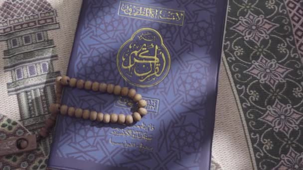 Quran Lies Atop Prayer Mat Wooden Prayer Beads Placed — Stock Video