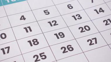 A printed monthly calendar with several dates circled in red, symbolizing important events, deadlines, or reminders. 